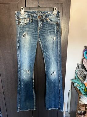 Silver Jeans Women's Distressed Flare Jeans in Blue Denim